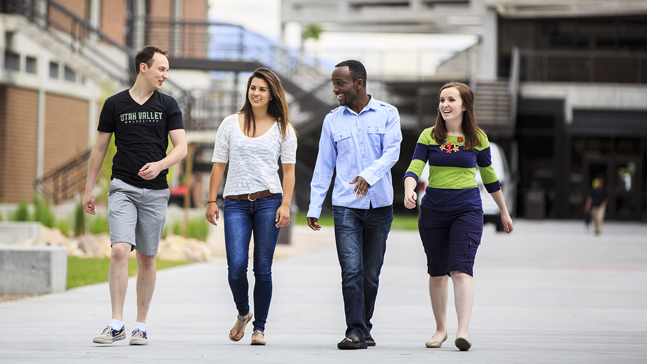 A group of students walking through campus